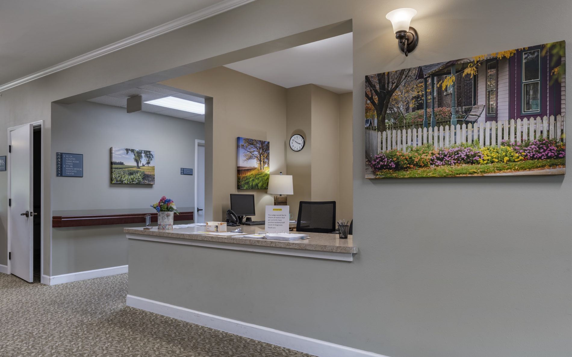 Front desk area with wall art
